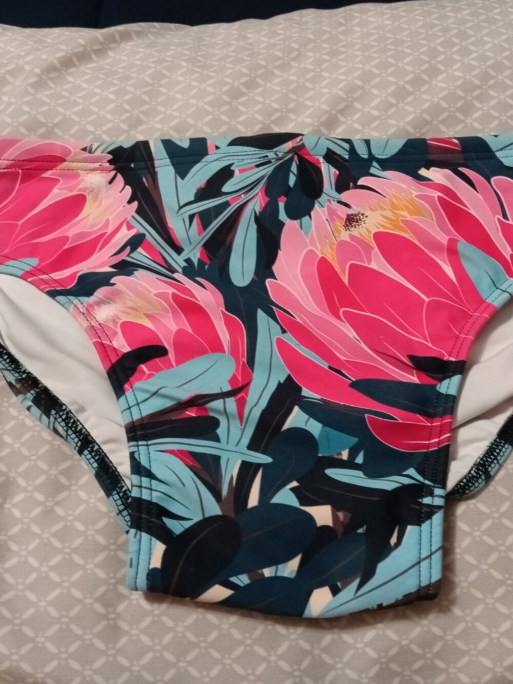 NWOT SLUGGERS "DEETEES" Flowered SWIM BRIEF, SIZE "XS"